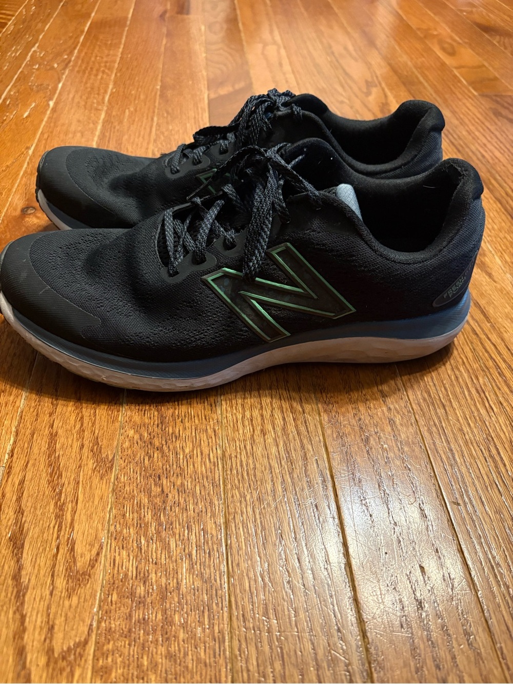 New Balance Black Sneakers with Green Logo Trim